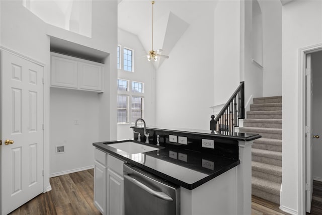 kitchen with dark hardwood / wood-style flooring, ceiling fan, sink, dishwasher, and white cabinetry