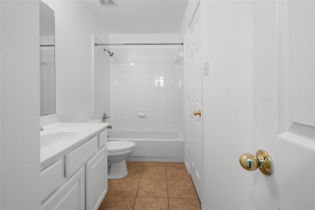 full bathroom with toilet, vanity, tile patterned floors, and tiled shower / bath