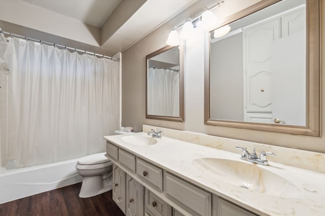 full bathroom with shower / bathtub combination with curtain, vanity, wood-type flooring, and toilet