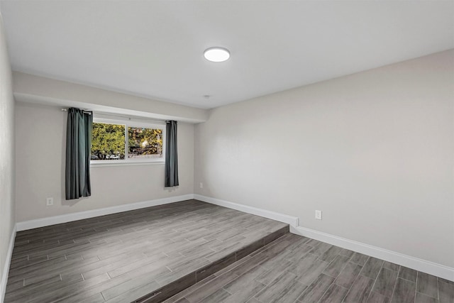 empty room with hardwood / wood-style floors