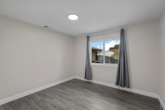 spare room featuring hardwood / wood-style floors