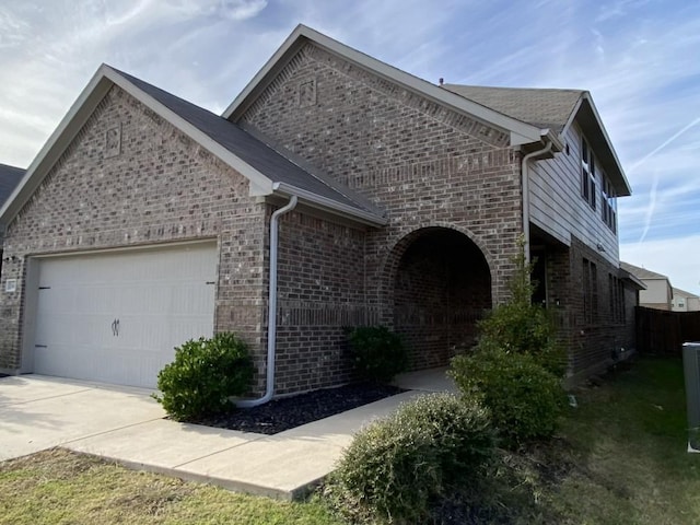 view of property exterior featuring a garage