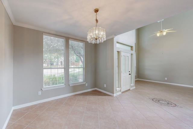 tiled spare room featuring ceiling fan with notable chandelier and crown molding