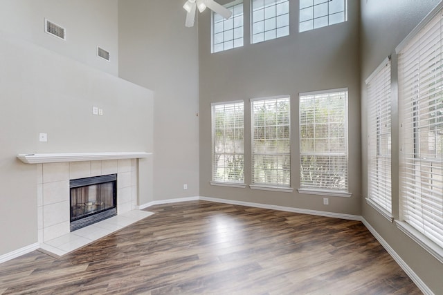 unfurnished living room with a wealth of natural light and hardwood / wood-style floors