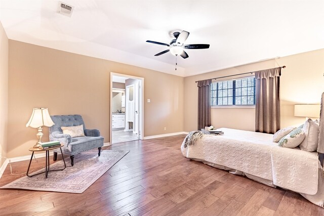 bedroom with hardwood / wood-style floors and ceiling fan