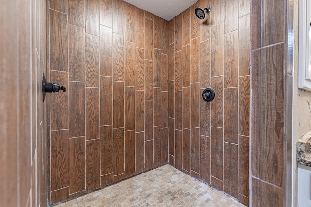 bathroom with a tile shower