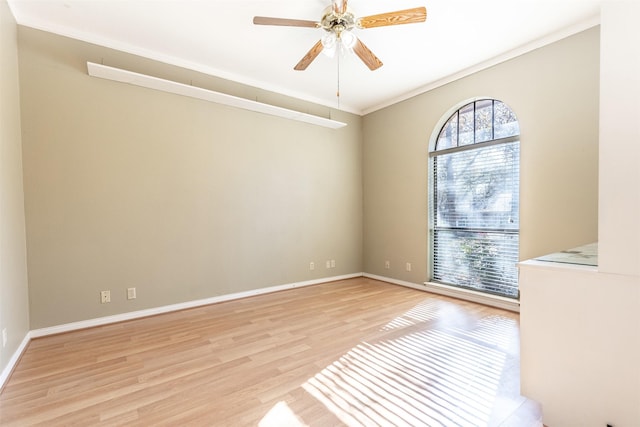 empty room featuring ornamental molding, ceiling fan, and light hardwood / wood-style flooring