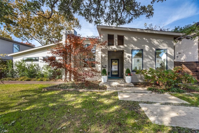 view of front of home with a front yard