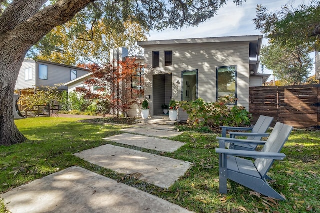 modern home with a front lawn