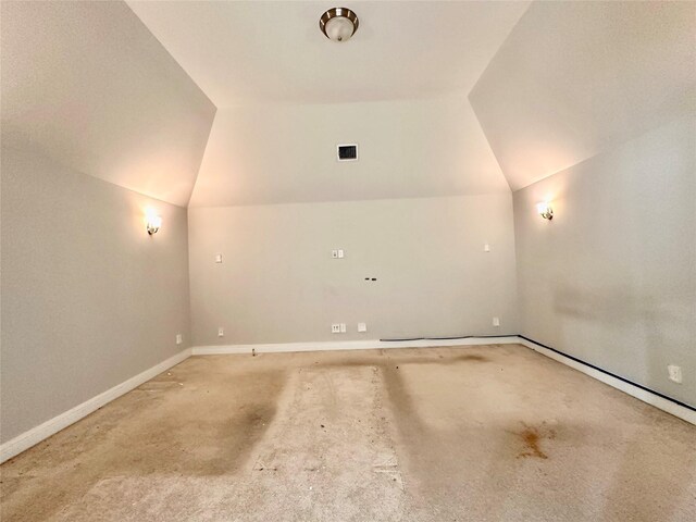 additional living space featuring vaulted ceiling