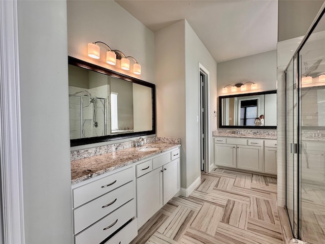 bathroom featuring vanity and an enclosed shower