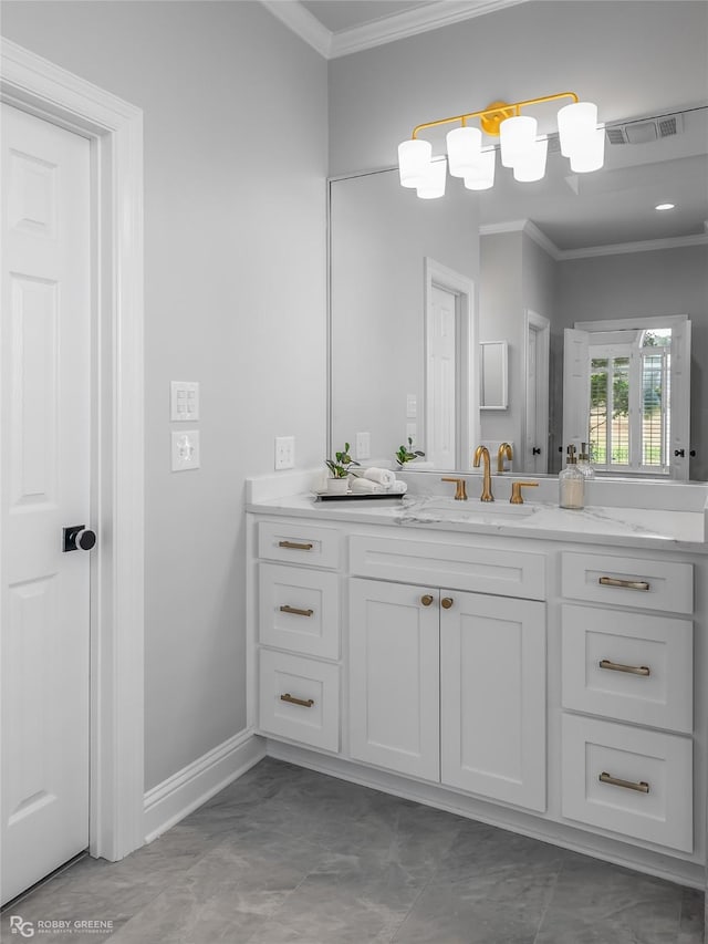 bathroom with crown molding and vanity