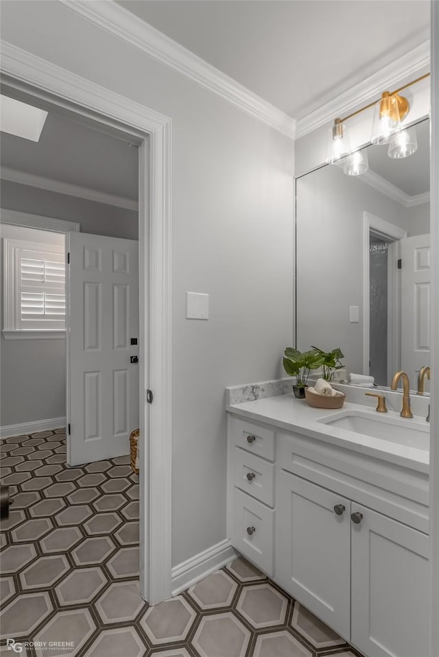 bathroom featuring ornamental molding and vanity