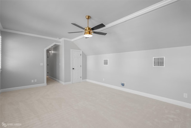 additional living space featuring lofted ceiling, light carpet, and ceiling fan