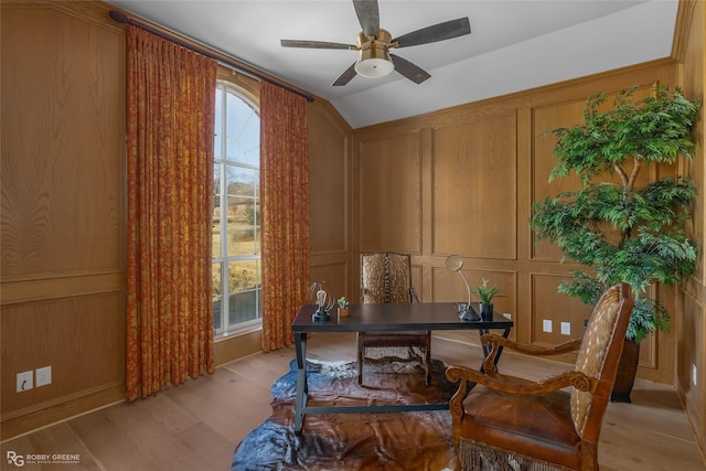 office area featuring lofted ceiling, light hardwood / wood-style floors, and ceiling fan