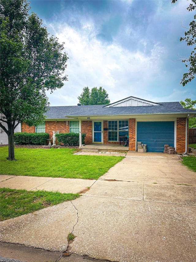 ranch-style home featuring a front yard and a garage