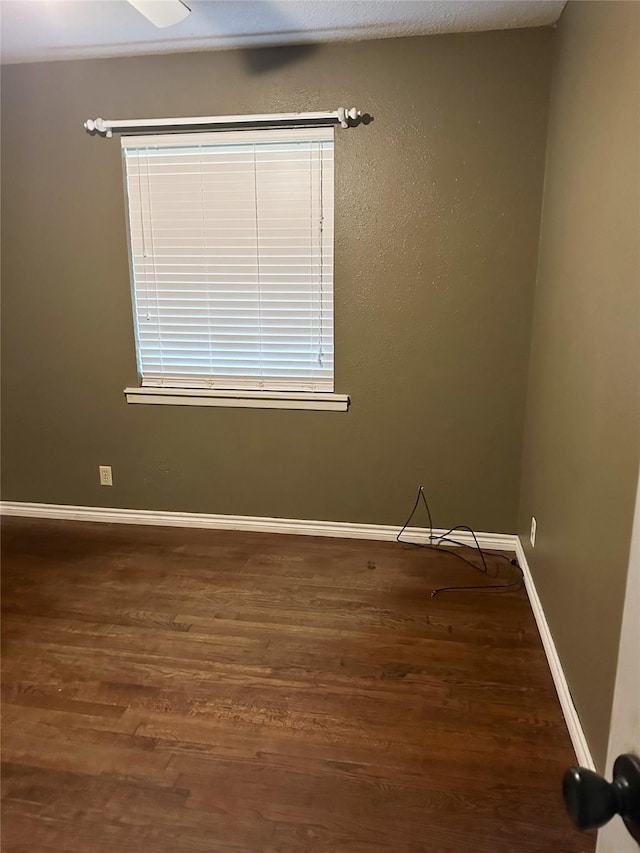 empty room with dark hardwood / wood-style floors