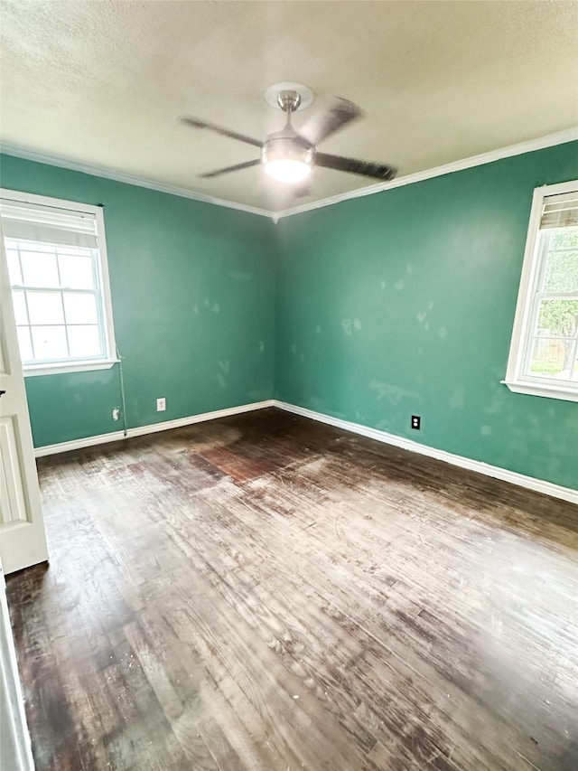 spare room with hardwood / wood-style flooring, ceiling fan, and ornamental molding