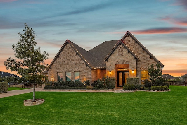 view of front of property with a yard