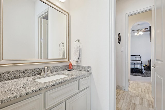 bathroom featuring vanity and ceiling fan