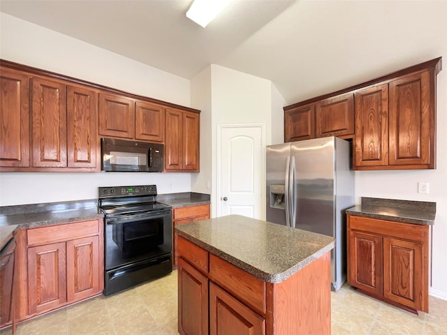 kitchen featuring black appliances, a center island, and light tile patterned flooring