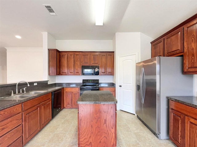 kitchen featuring black appliances, a kitchen island, and sink