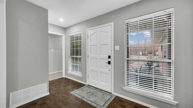 entrance foyer with dark hardwood / wood-style floors