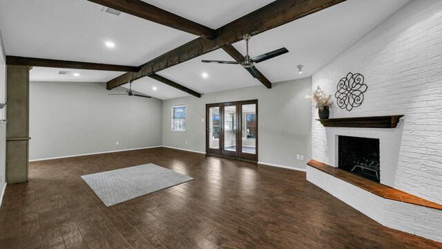 unfurnished living room featuring vaulted ceiling with beams, ceiling fan, dark hardwood / wood-style flooring, and a brick fireplace