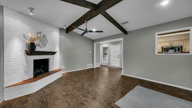 unfurnished living room with a fireplace, vaulted ceiling with beams, dark hardwood / wood-style floors, and ceiling fan