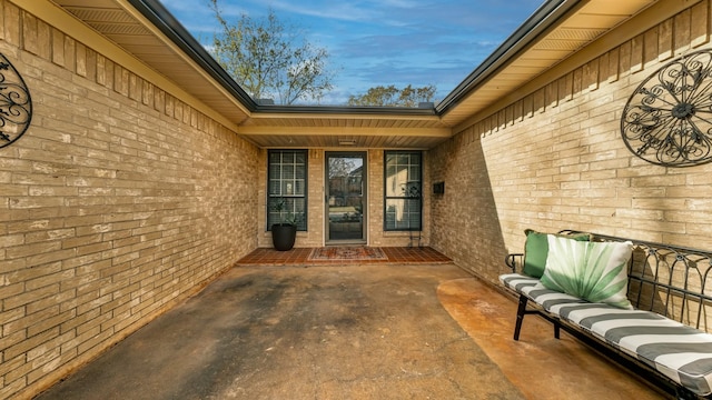 property entrance with a patio area