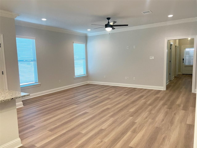 unfurnished living room with plenty of natural light and light hardwood / wood-style floors