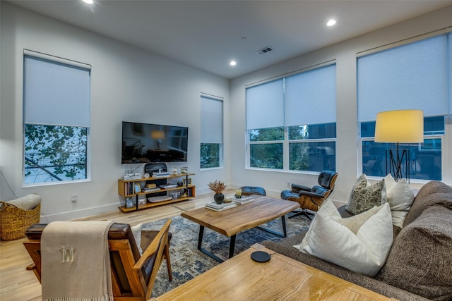 living room with plenty of natural light and light wood-type flooring