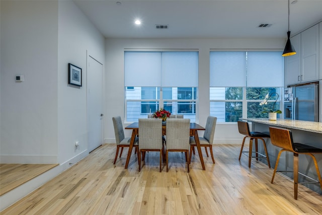 dining area featuring light wood-type flooring