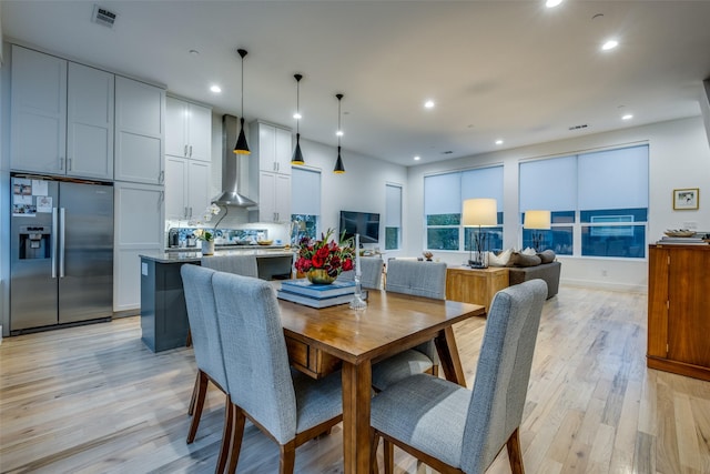 dining area with light hardwood / wood-style flooring