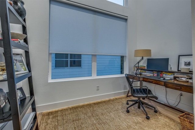 office space with wood-type flooring