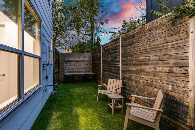 view of yard at dusk