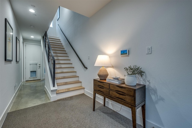 stairs featuring concrete floors