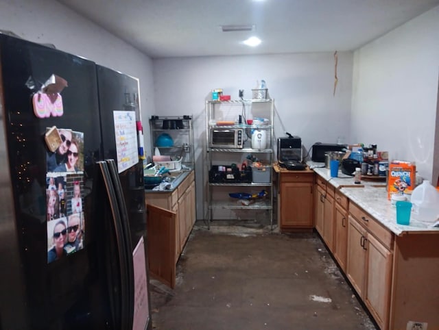 kitchen with black fridge