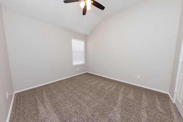 unfurnished room featuring ceiling fan, carpet, and vaulted ceiling