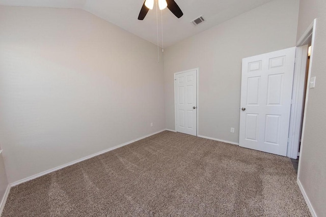 spare room with carpet flooring, ceiling fan, and lofted ceiling