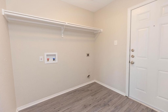 laundry room featuring electric dryer hookup, wood-type flooring, and hookup for a washing machine