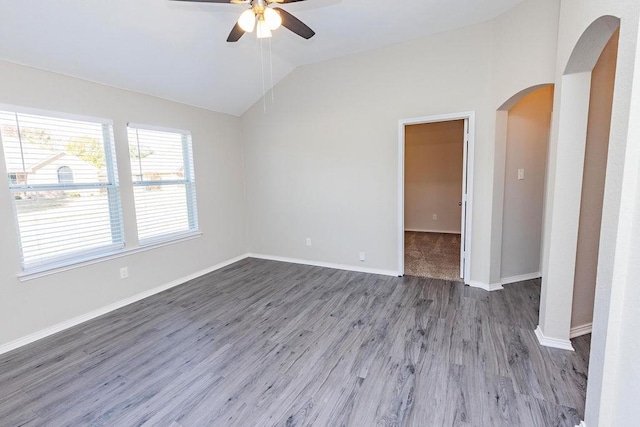 unfurnished room featuring ceiling fan, wood-type flooring, and vaulted ceiling