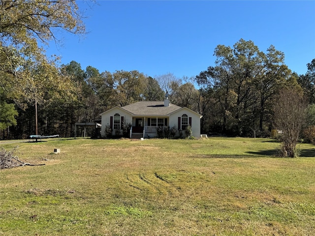 view of front facade with covered porch and a front lawn