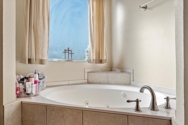 bathroom with a relaxing tiled tub