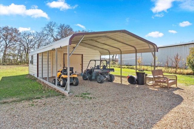 view of outbuilding with a carport and a yard