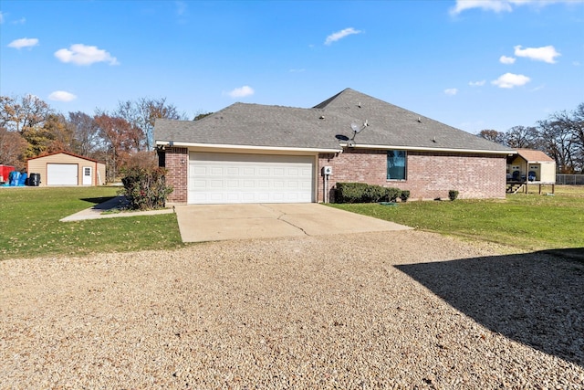 view of side of home featuring a garage and a lawn