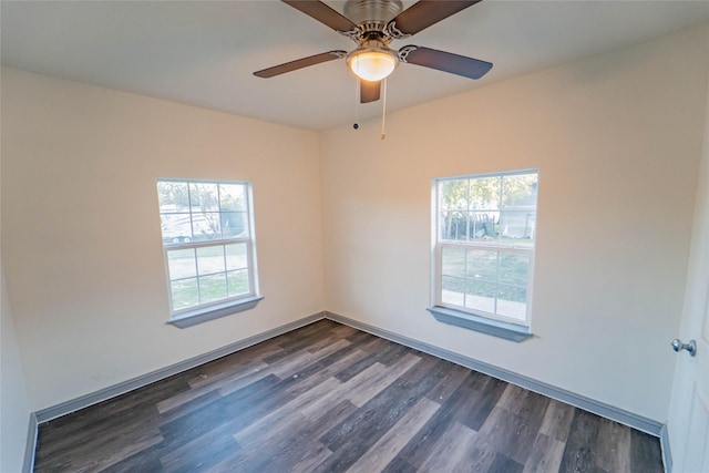 unfurnished room featuring dark hardwood / wood-style flooring