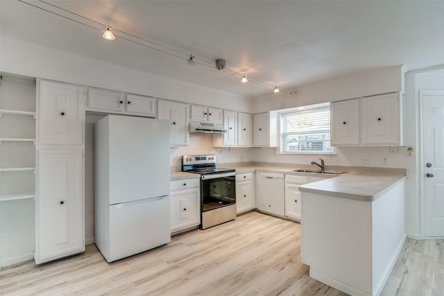 kitchen with white cabinetry, white appliances, light hardwood / wood-style floors, and sink