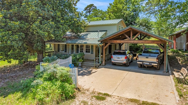 view of front of house with a porch and a carport