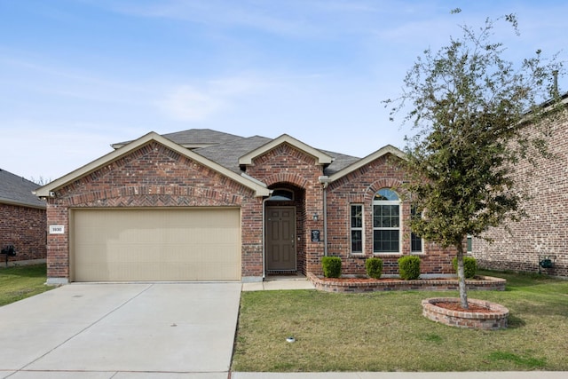 view of front facade with a garage and a front lawn